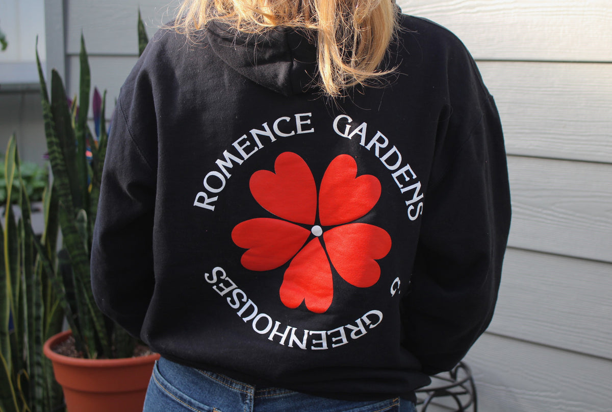 Romence Gardens Logo Hoodie back being worn