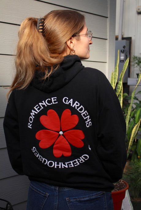 Romence Gardens Logo Hoodie back being worn